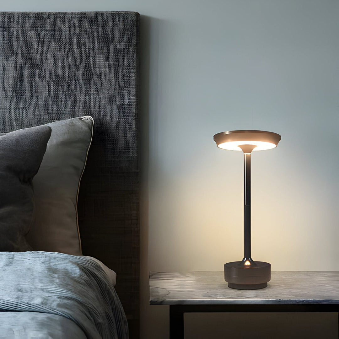 Slim modern cordless LED table lamp, dimmable for ambiance. Ideal accent light for contemporary home decor.