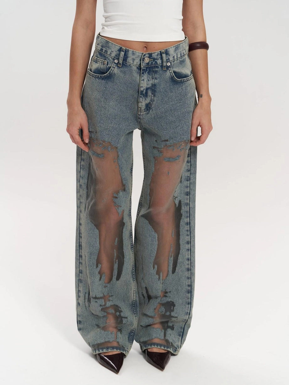 Women's high waist wide leg jeans with unique mesh panel detailing. Trendy denim bottoms for a stylish look.