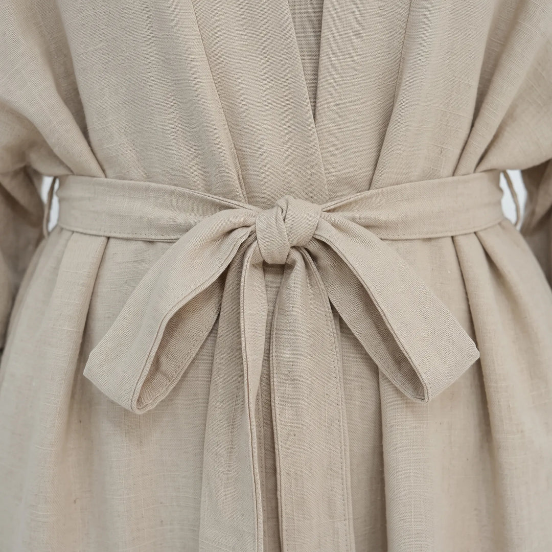 Modest women's abaya set featuring a long dress and matching open cardigan for a layered look.