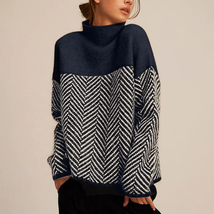 Relaxed fit women's turtleneck sweater with a cozy chevron knit. Long sleeve, comfortable winter knitwear.