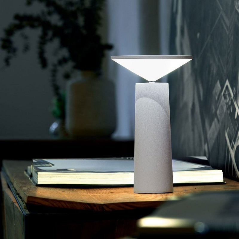 Versatile modern LED table lamp, dimmable, portable, & wireless for any space.