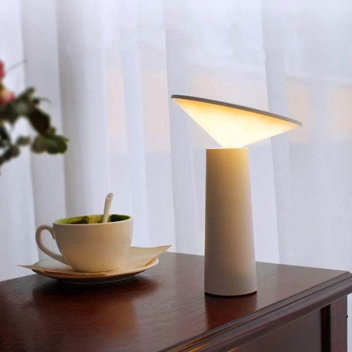 Sleek black modern LED table lamp, dimmable & wireless for minimalist home decor.