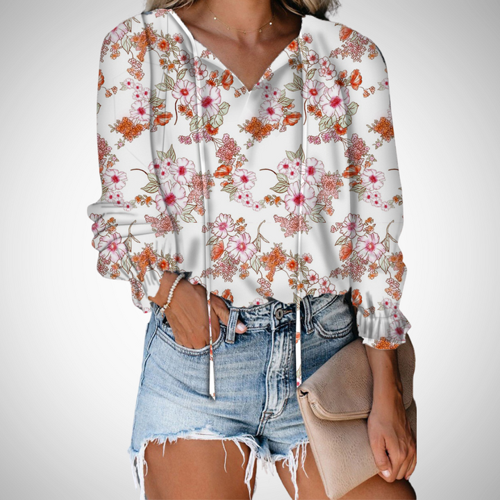 Comfortable women's flowy V-neck top, long sleeve. Printed blouse for casual elegance.
