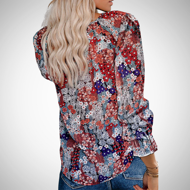 Women's V-neck floral print long sleeve blouse, flowy design. Perfect for seasonal fashion.