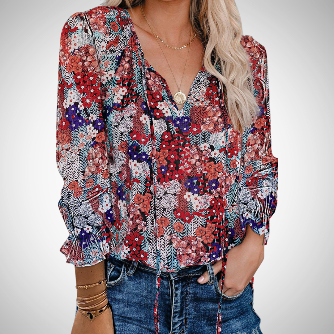 Stylish women's long sleeve printed V-neck blouse. Flowy top for a chic, comfortable look.