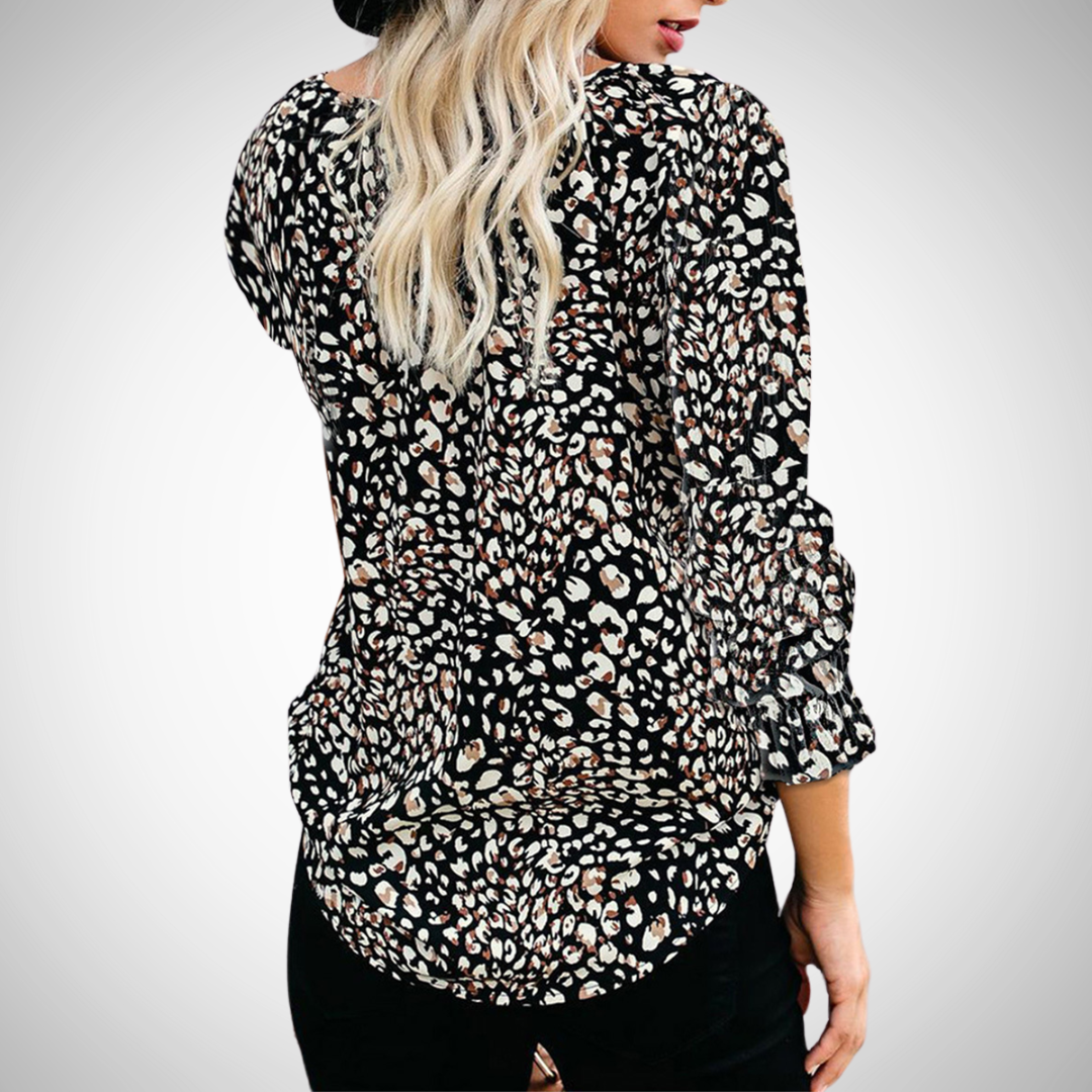 Casual women's flowy V-neck blouse, long sleeve. Stylish printed top for everyday fashion.