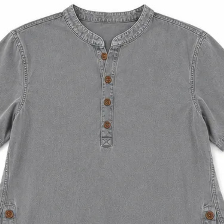 Side view: Women's Henley tunic shirt, highlighting decorative buttons & relaxed fit for casual style.