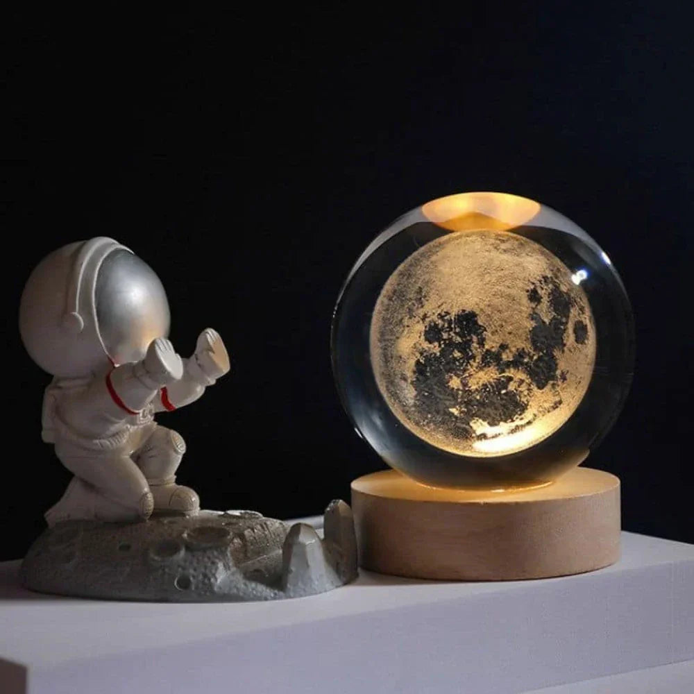 Captivating 3D galaxy crystal ball light with a wooden base, creating a luminous space decor for any room.
