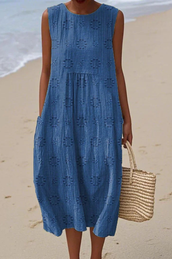 Feminine flowing embroidered maxi dress, a new elegant sleeveless choice for casual or special events.
