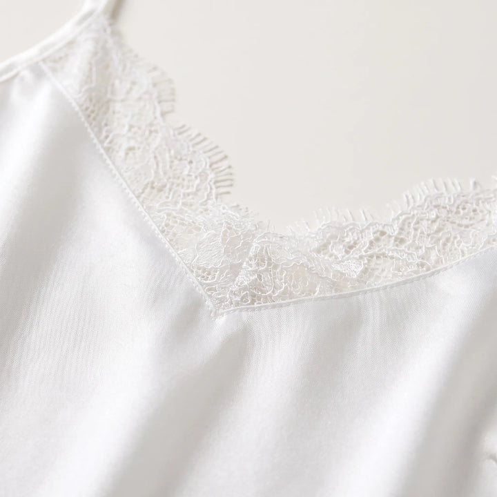 Soft white V-neck cami nightdress for women, featuring a relaxed fit. Elegant sleeveless sleepwear & loungewear.