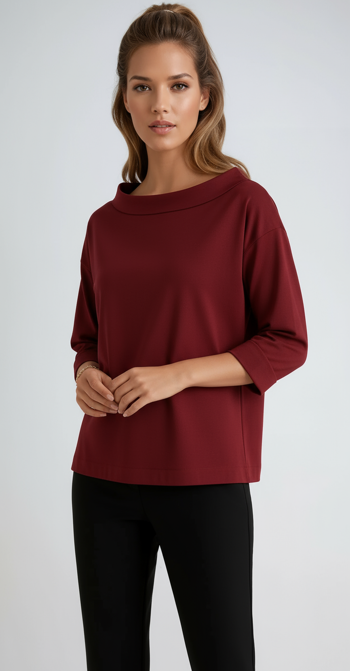 Minimalist women's top featuring a boat neck and 3/4 sleeves. Relaxed fit for ultimate comfort, suitable for work.