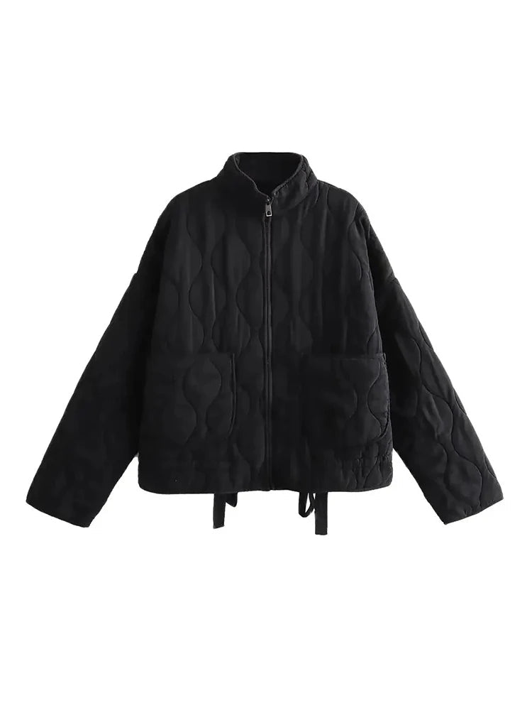 Classic women's vintage quilted jacket. Chic autumn outerwear for a cozy, retro fashion statement.