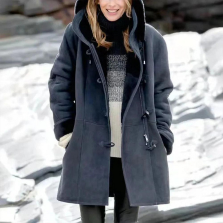 Close-up of a cozy, warm hooded jacket fabric, highlighting its soft texture & durable winter outerwear quality.