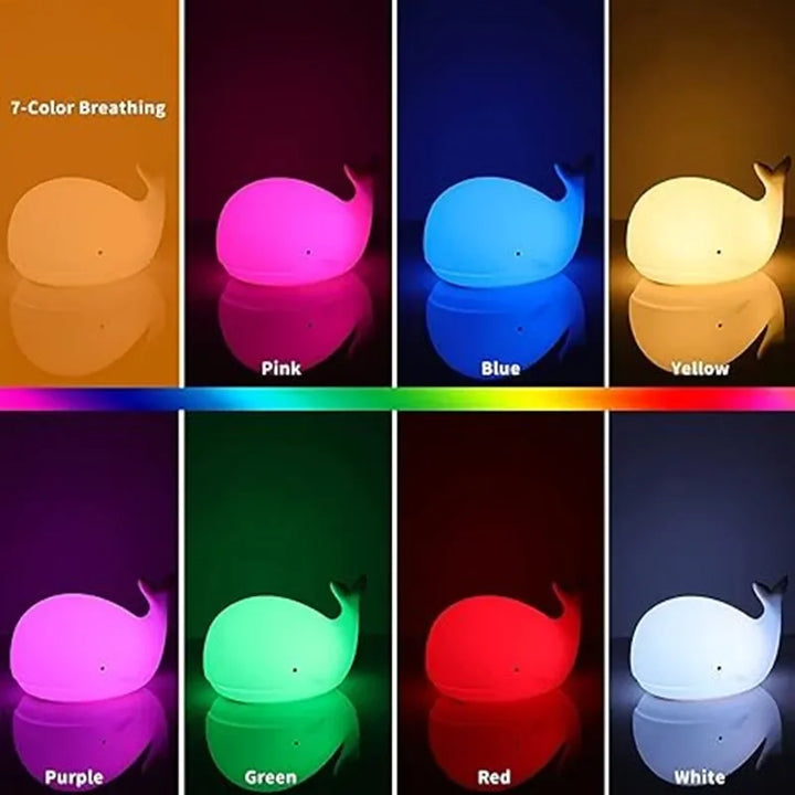 Children's silicone whale night light. Dimmable, colorful LED glow for nursery or kids' bedroom. Rechargeable.