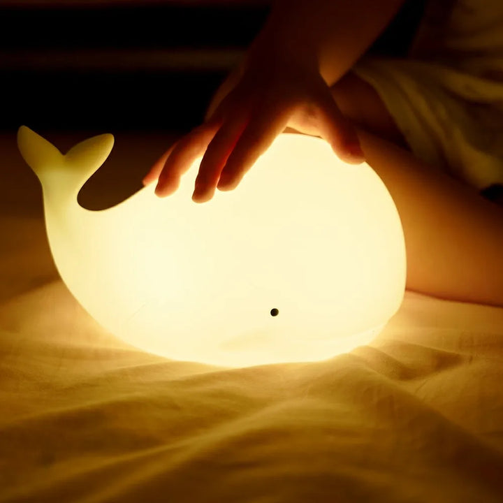Adorable GlowWhale rechargeable LED kids lamp. Soft silicone, colorful light, perfect baby gift & nursery decor.