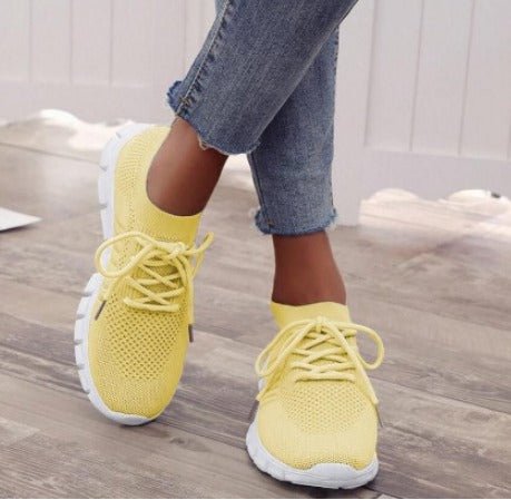 Stylish women's lightweight lace-up athletic sneakers in grey. Perfect for everyday comfort, walking, and casual wear.