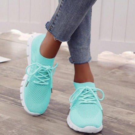 Women's comfortable lace-up athletic sneakers. Features breathable mesh for lightweight everyday wear & modern style.