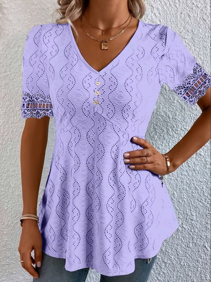 Unique women's patchwork V-neck blouse with short sleeves, perfect for casual or sophisticated wear. Fashionable top.