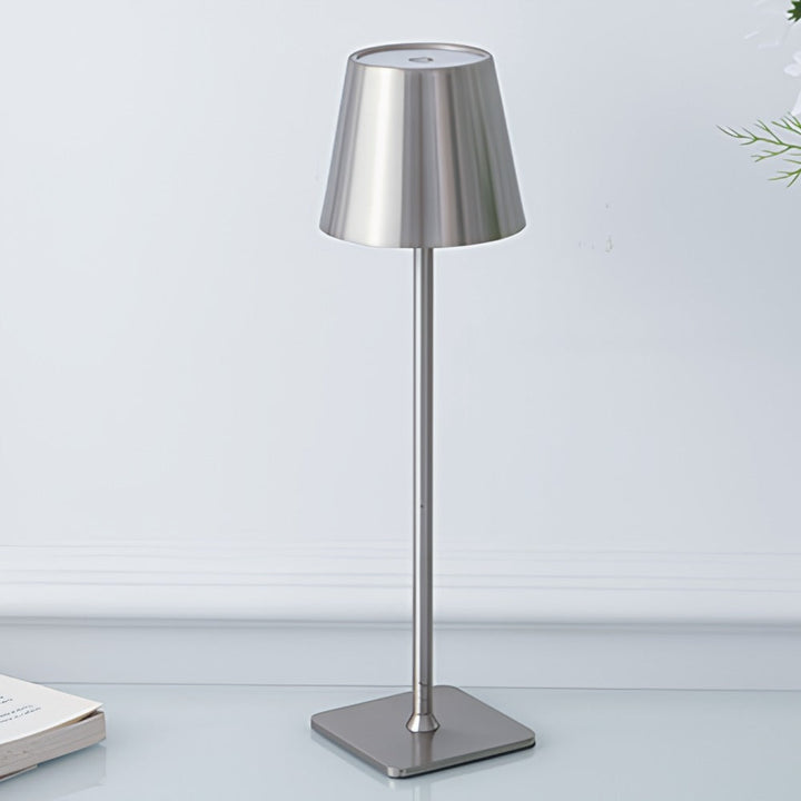 Stylish modern LED table lamp, dimmable, rechargeable. Perfect portable light for any setting.