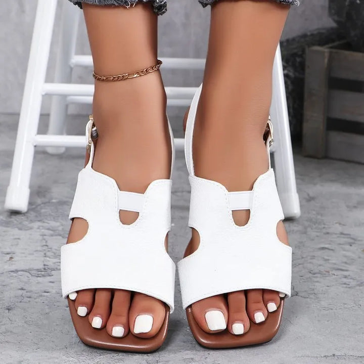Modern women's stylish cut-out flat sandals, offering comfort and versatility for everyday summer and spring fashion outfits.
