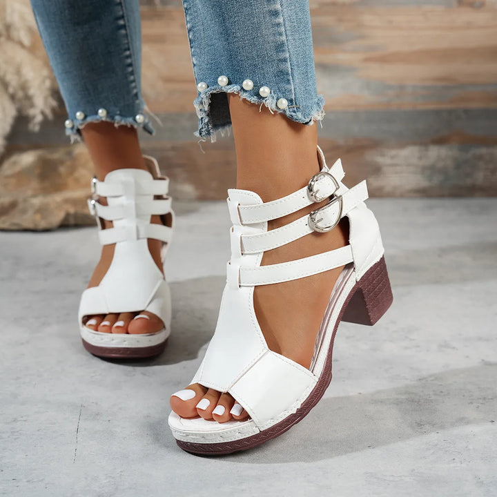 Comfortable mid-heel open-toe sandals for women, featuring a stylish block heel & secure buckle strap.