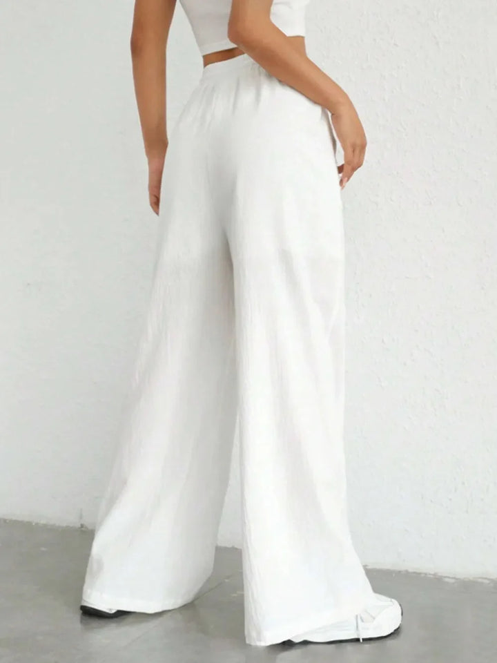 Fashionable women's loose fit pants with drawstring waist; perfect for lounge or everyday style.