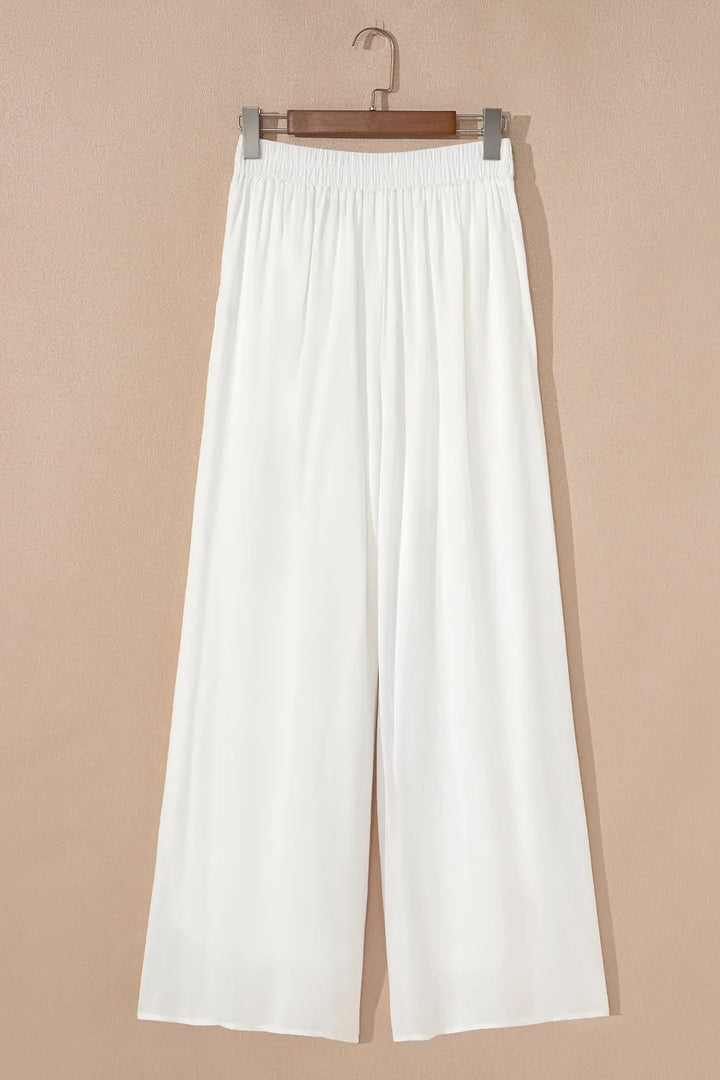 Comfortable women's white wide leg pants with drawstring waist, great for all-day casual wear.
