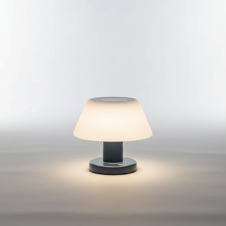 Portable rechargeable LED table light for indoor/outdoor use, creating a warm ambiance.