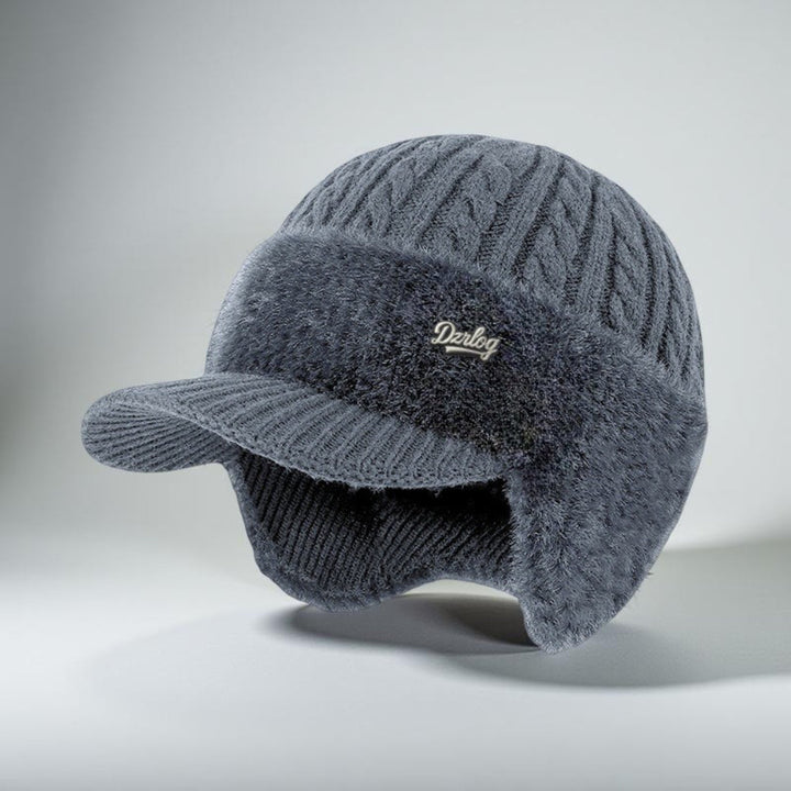 Stylish trapper hat with adjustable ear flaps & baseball visor, perfect for men & women's winter fashion.