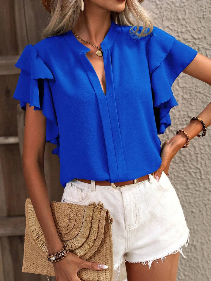 Front view of a women's ruffled short sleeve blouse, highlighting the elegant design and casual fit.