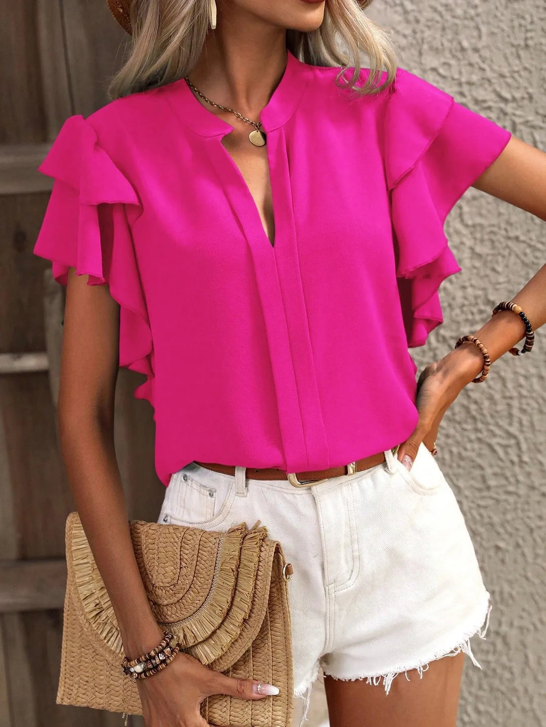 Women's ruffled short sleeve blouse in a casual, chic style for summer fashion and office wear.
