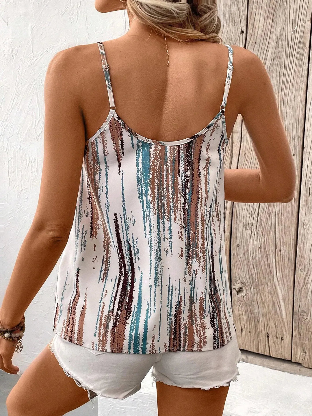 Chic women's striped sleeveless tank top. Versatile summer blouse for casual everyday comfort and warm weather.