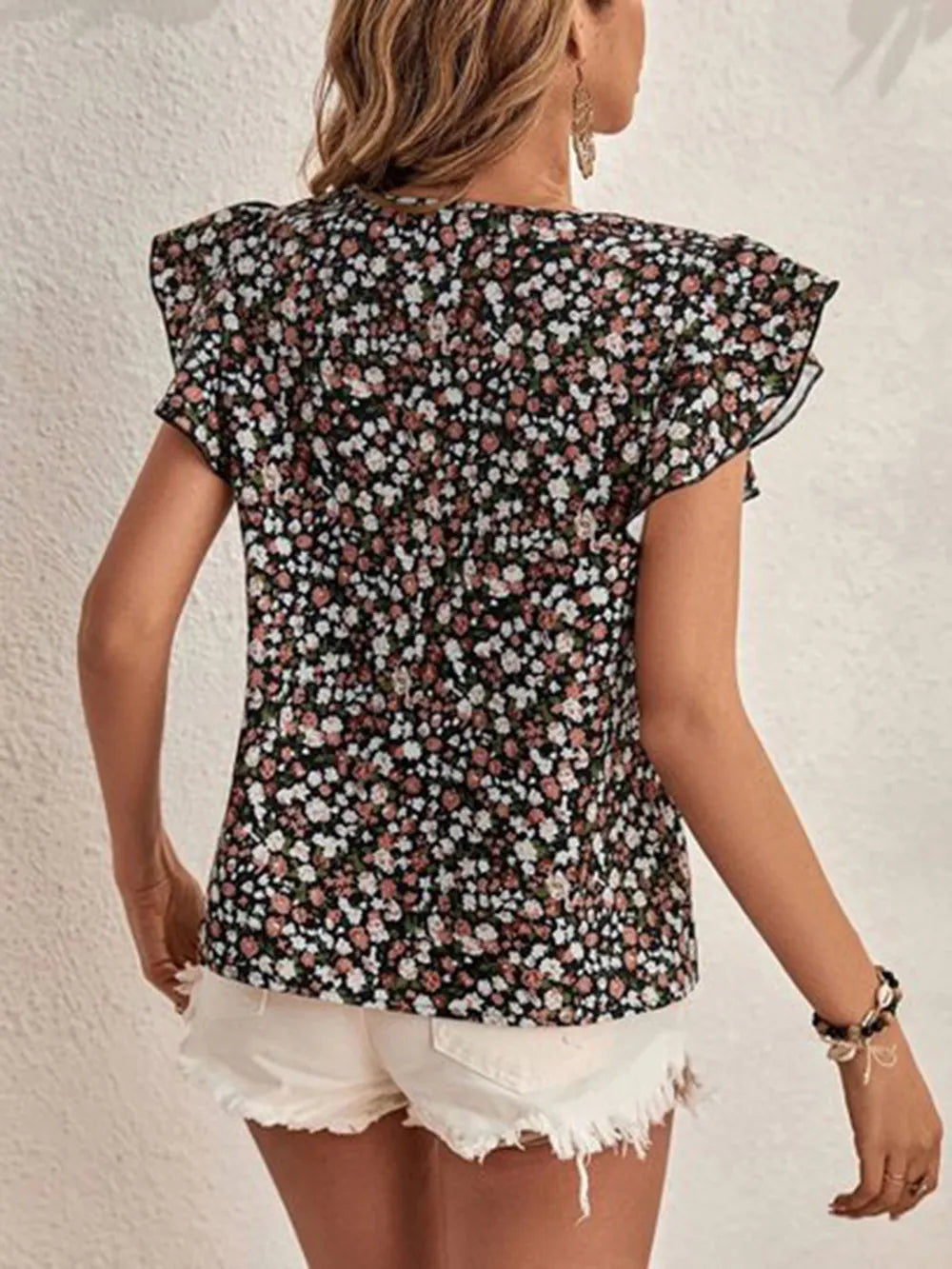 Easy-wear women's floral top with charming ruffle sleeves, a versatile printed shirt for casual summer fashion.