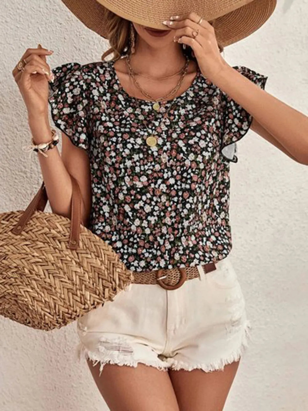 Modern women's floral print top featuring elegant ruffle sleeves; a casual yet feminine addition to any wardrobe.
