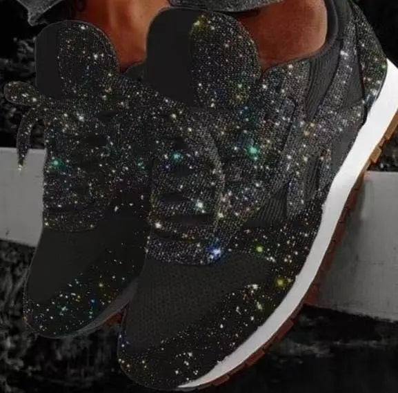 Women's glamorous silver glitter platform sneakers, chunky fashion shoes for a trendy look.