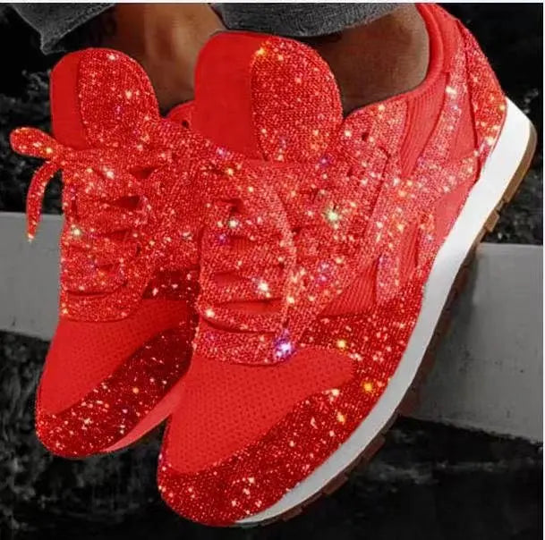 Trendy women's platform sneakers with dazzling glitter, perfect for a glamorous chunky casual look.