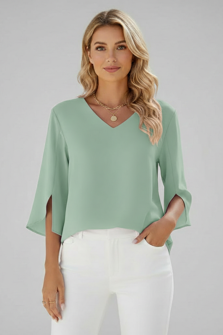 Close-up of elegant women's V-neck short-sleeve blouse, showcasing its sophisticated relaxed fit.