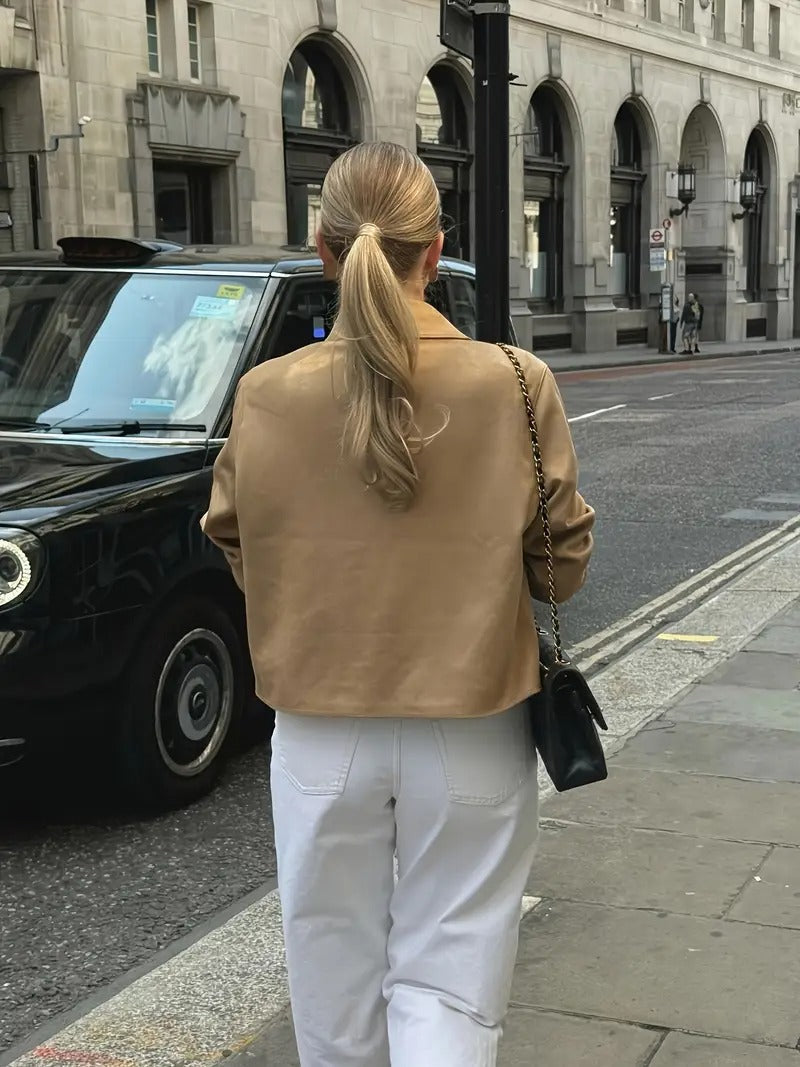 Classic women's taupe button-down jacket. Elegant & versatile outerwear, ideal for spring and fall outfits.
