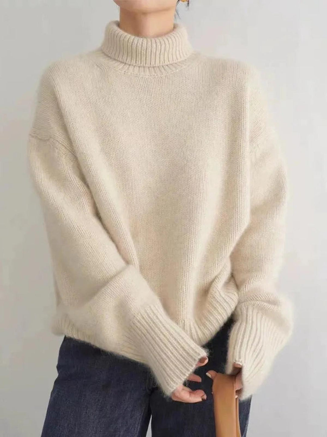 Chic women's essential turtleneck top, perfect for layering. Warm, long-sleeve & cozy for winter style.