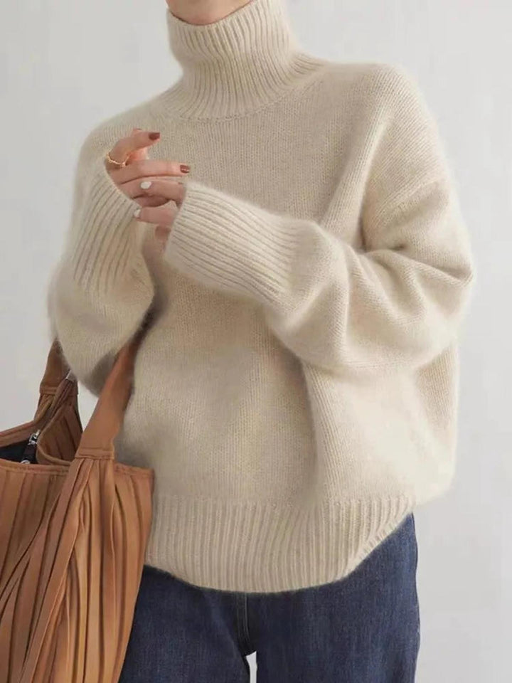 Cozy women's warm turtleneck sweater. Relaxed fit, long-sleeve pullover for ultimate winter comfort & style.