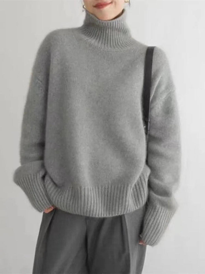 Stylish women's warm turtleneck for winter fashion. Long-sleeve, relaxed fit pullover for cozy everyday wear.