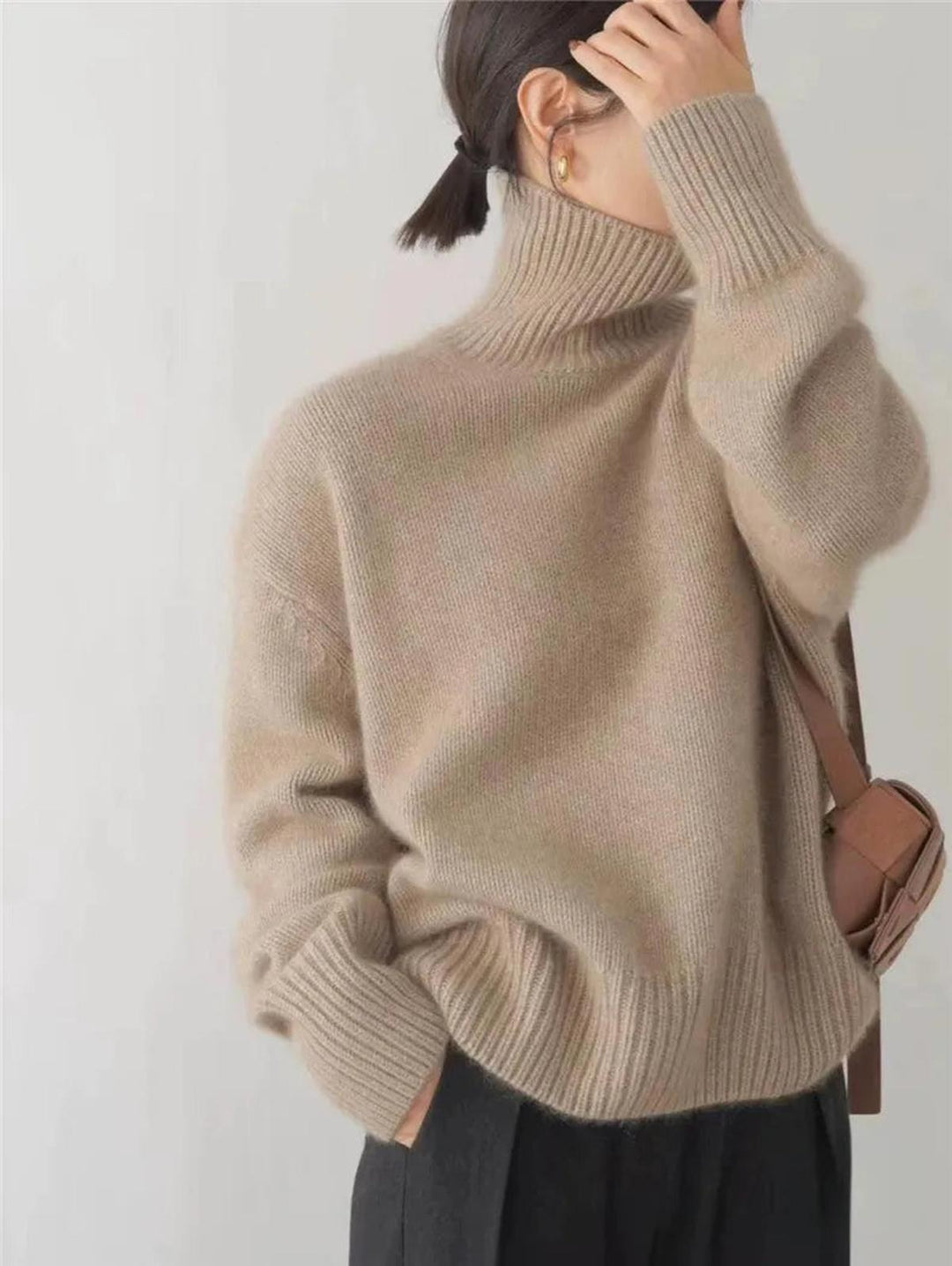 Women's cozy essential turtleneck. Relaxed fit, warm long-sleeve top for winter layering and chic everyday wear.