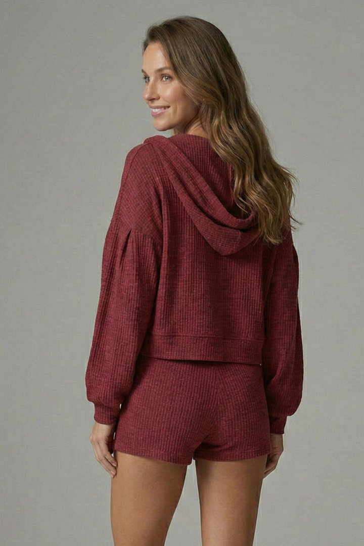 High-waist shorts from a women's casual 3-piece set, paired with a bralette. Ideal for summer outfits.