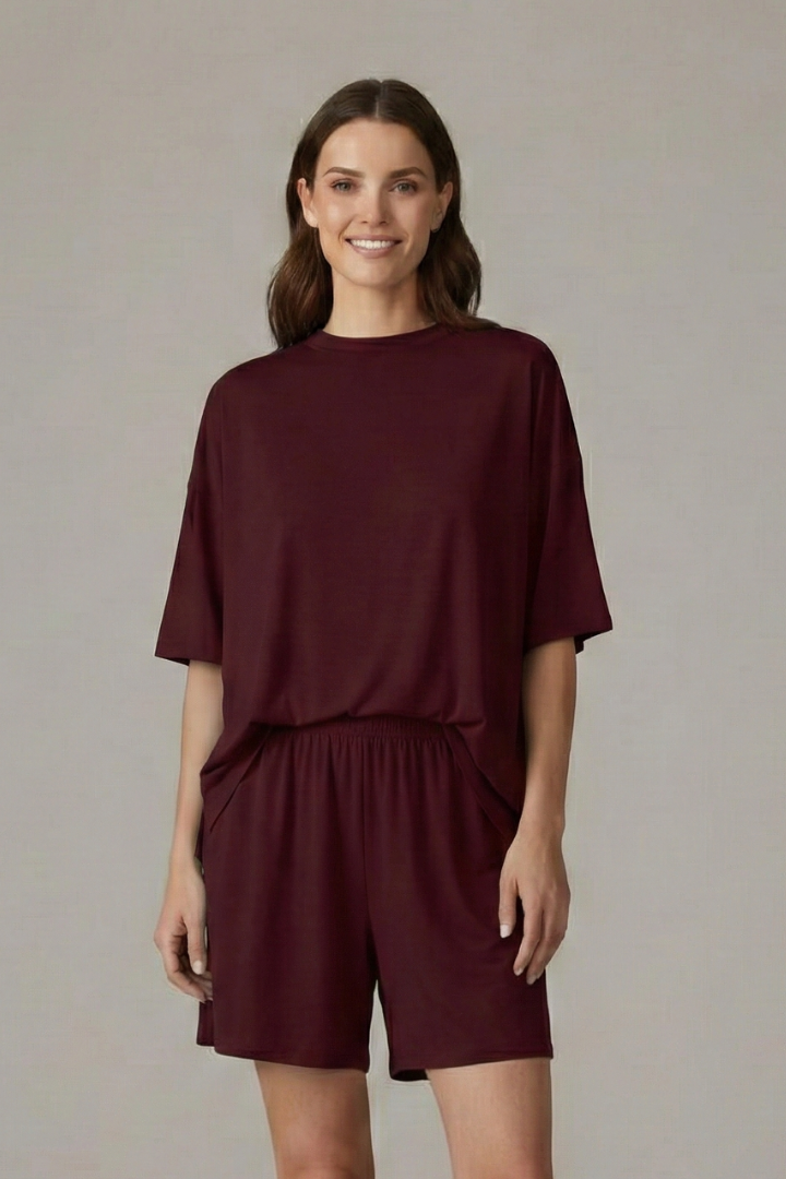 Women's casual shorts set: crew neck top & loose, elastic waist shorts for comfortable summer wear.
