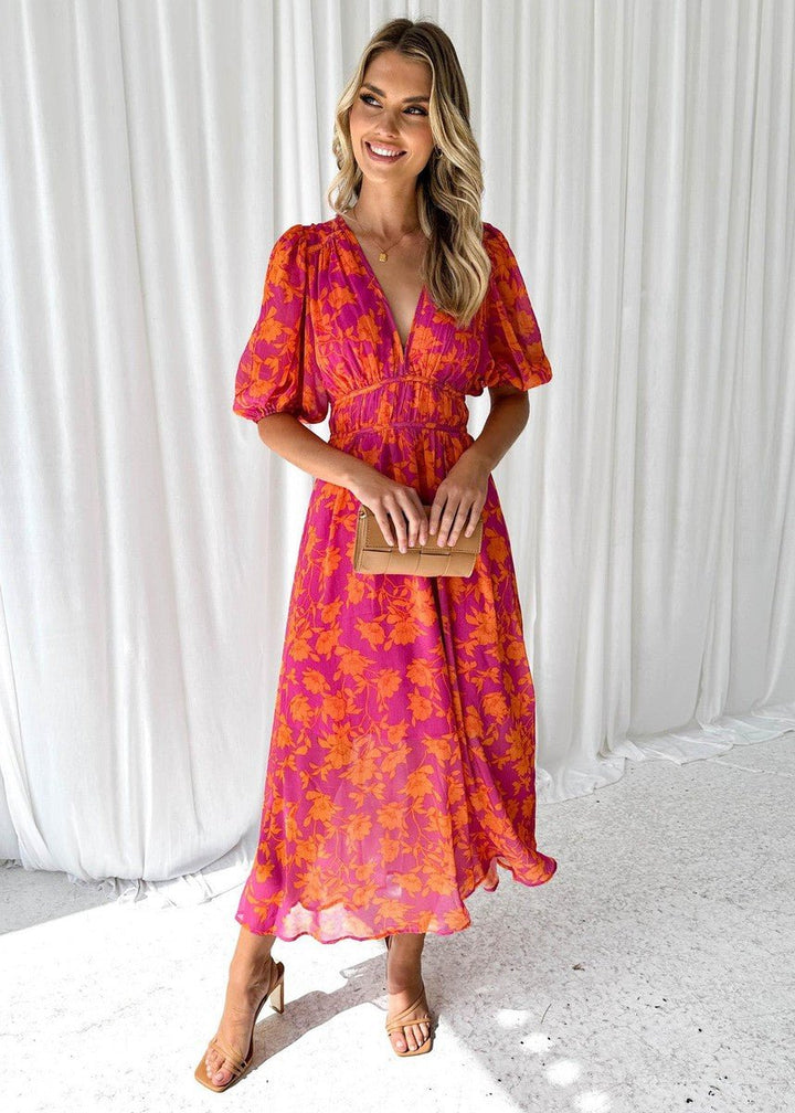 Women's elegant floral V-neck midi dress with stylish puff sleeves, perfect for summer parties or wedding guests.