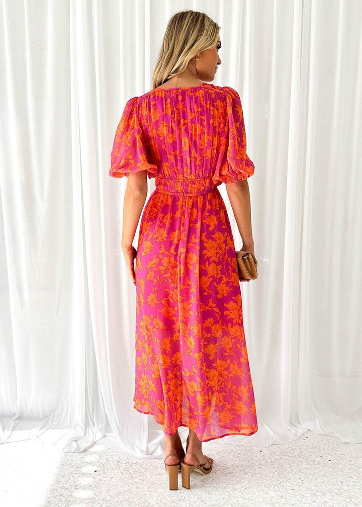 Stylish women's floral midi dress with chic puff sleeves and V-neck, ideal for warm weather casual wear.