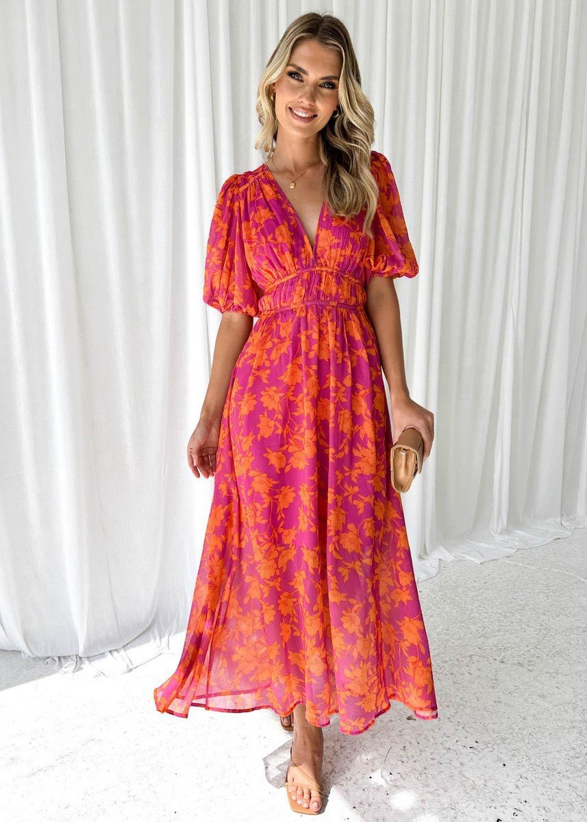 Elegant women's floral V-neck midi dress, boasting delicate puff sleeves and a flowing silhouette, for events.