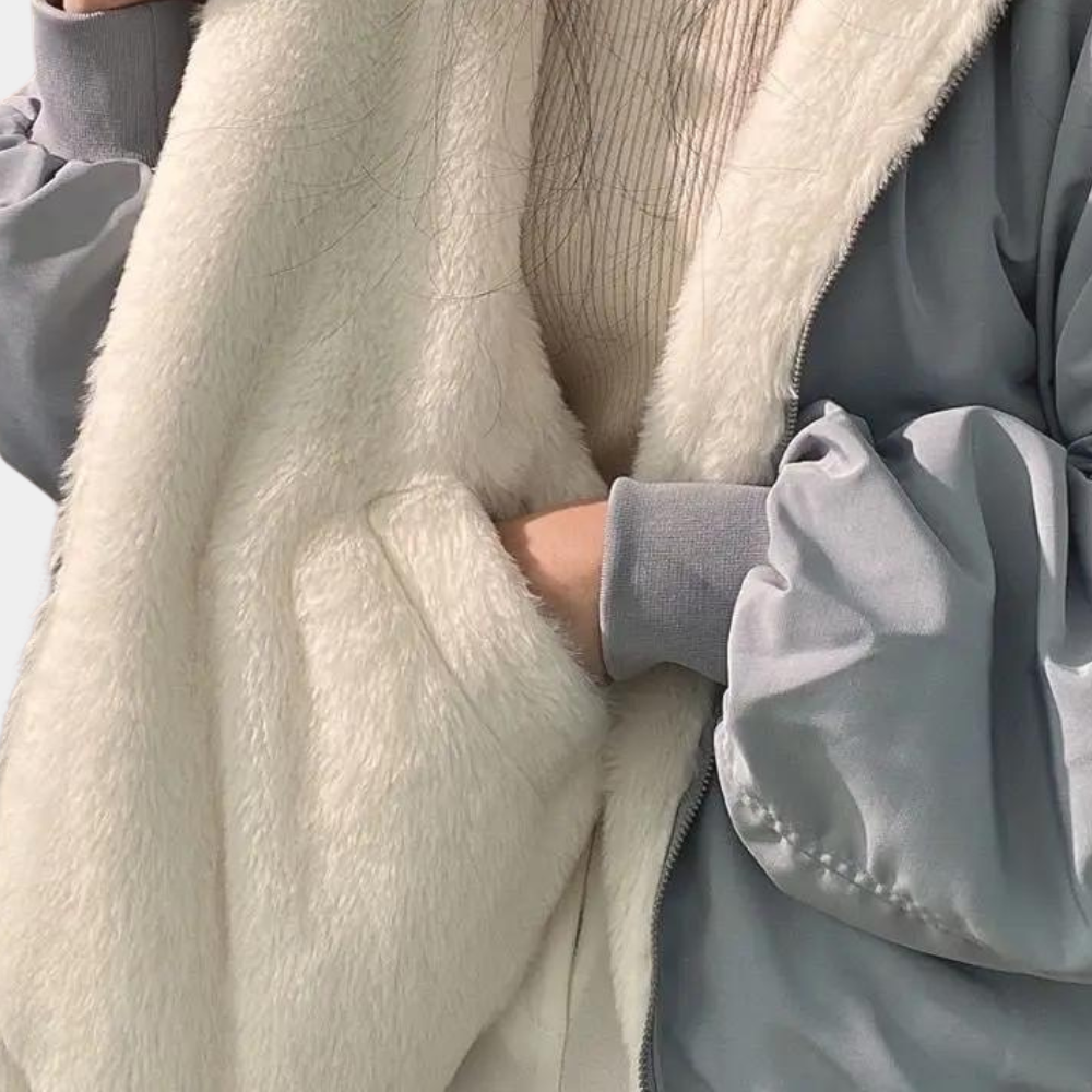Full-length view of a women's elegant oversized winter coat, a must-have for cold weather fashion.