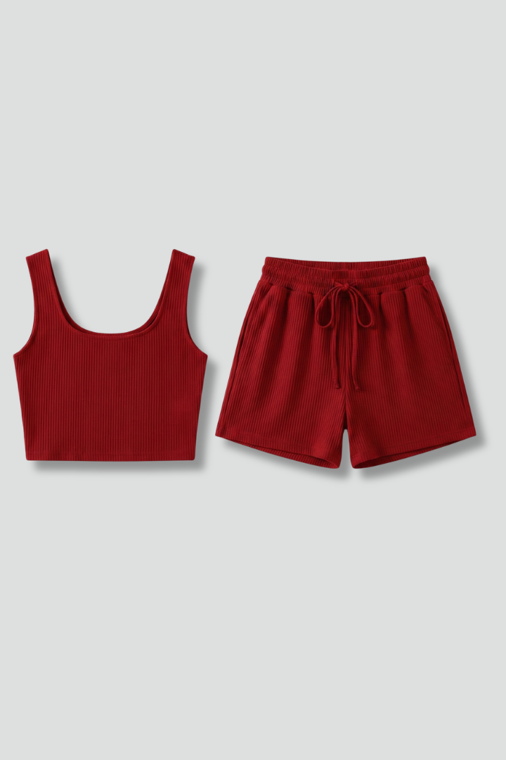 Stylish women's summer outfit: sleeveless crop top and elastic waist shorts set, perfect for lounge or beach.