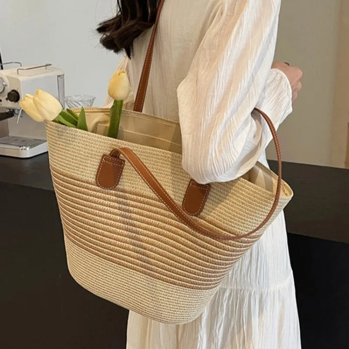 Stylish women's two-tone beach tote bag with comfortable shoulder straps for summer.
